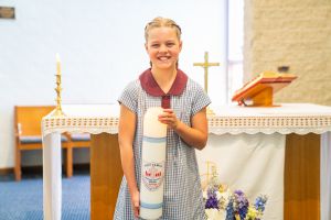Holy Family Catholic Primary School Menai student holding a candle